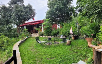 Open lawn area with bonfire setup overlooking the valley