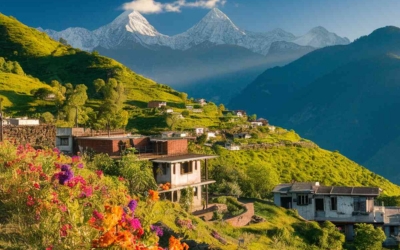 Himalayan village houses nestled on a hillside with snow-capped mountains in the background